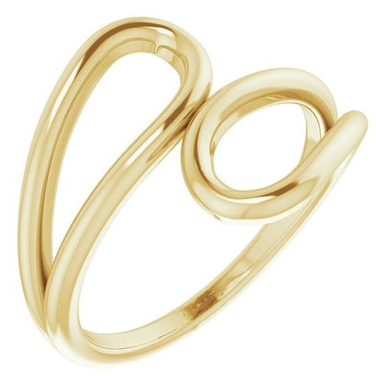 A polished yellow gold open wrap ring with a minimalist, flowing design, shown on a solid white background.