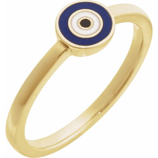 A gold ring featuring a circular evil eye charm with blue, white, and black enamel details, set against a plain white background.